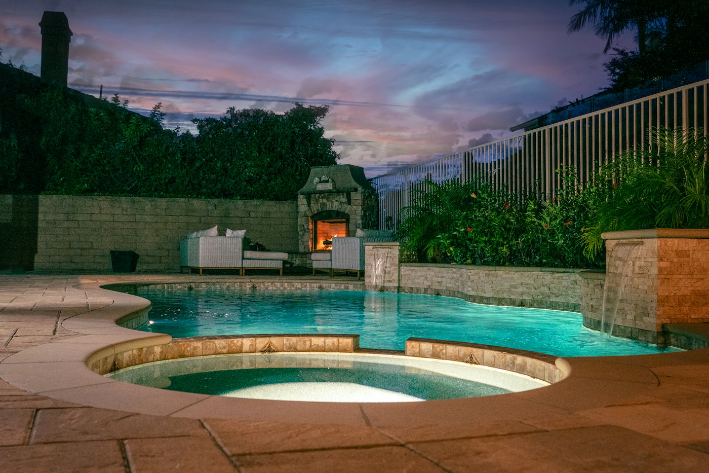 Swimming pool and spa at dusk